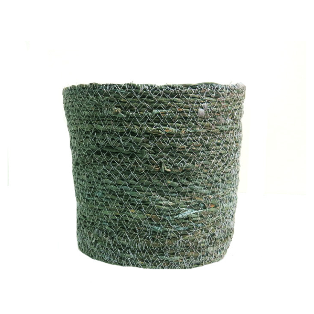 This Abasi Basket is a beautifully woven jute planter basket, displaying tones of misty grey, blue, and green. It is meticulously woven and includes a planter lining for extra durability. Measuring 17cm in diameter and 16cm in height, it is an ideal addition to any room. Unique Boys. www.uniqueboys.co.za