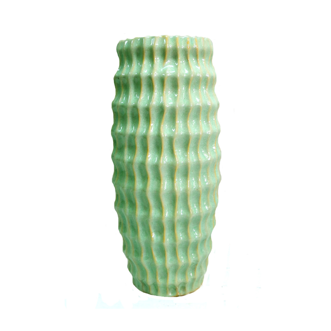 Atlantis Vase - Lime Green Ceramic Masterpiece
Elevate your space with the vibrant Atlantis Vase, a stunning ceramic piece boasting a striking lime green glaze. Its elegant design combines aesthetic appeal with functionality, perfect for adding a pop of color to any room