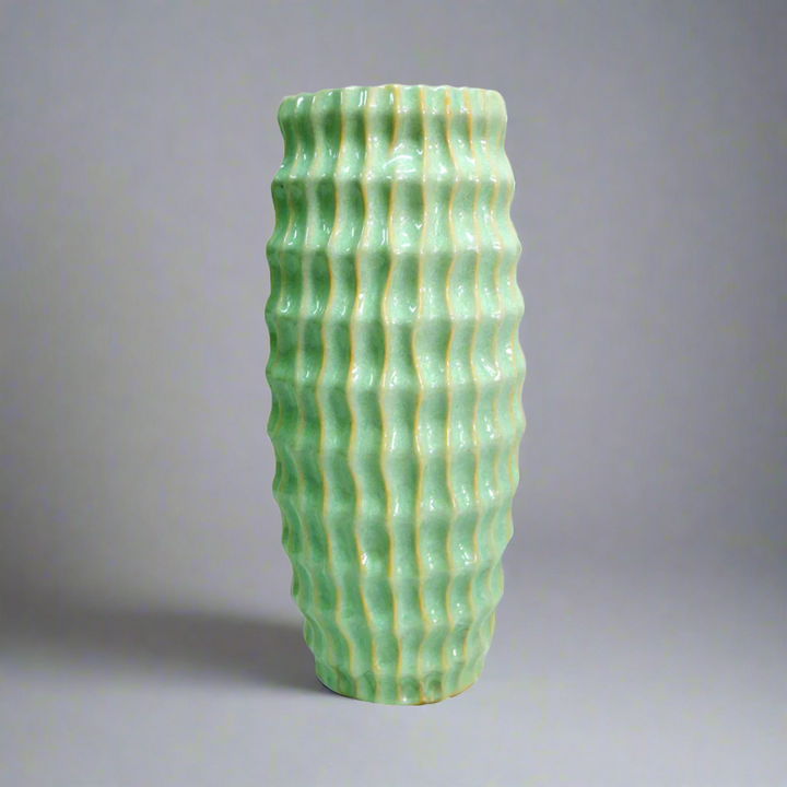 Atlantis Vase - Lime Green Ceramic Masterpiece
Elevate your space with the vibrant Atlantis Vase, a stunning ceramic piece boasting a striking lime green glaze. Its elegant design combines aesthetic appeal with functionality, perfect for adding a pop of color to any room