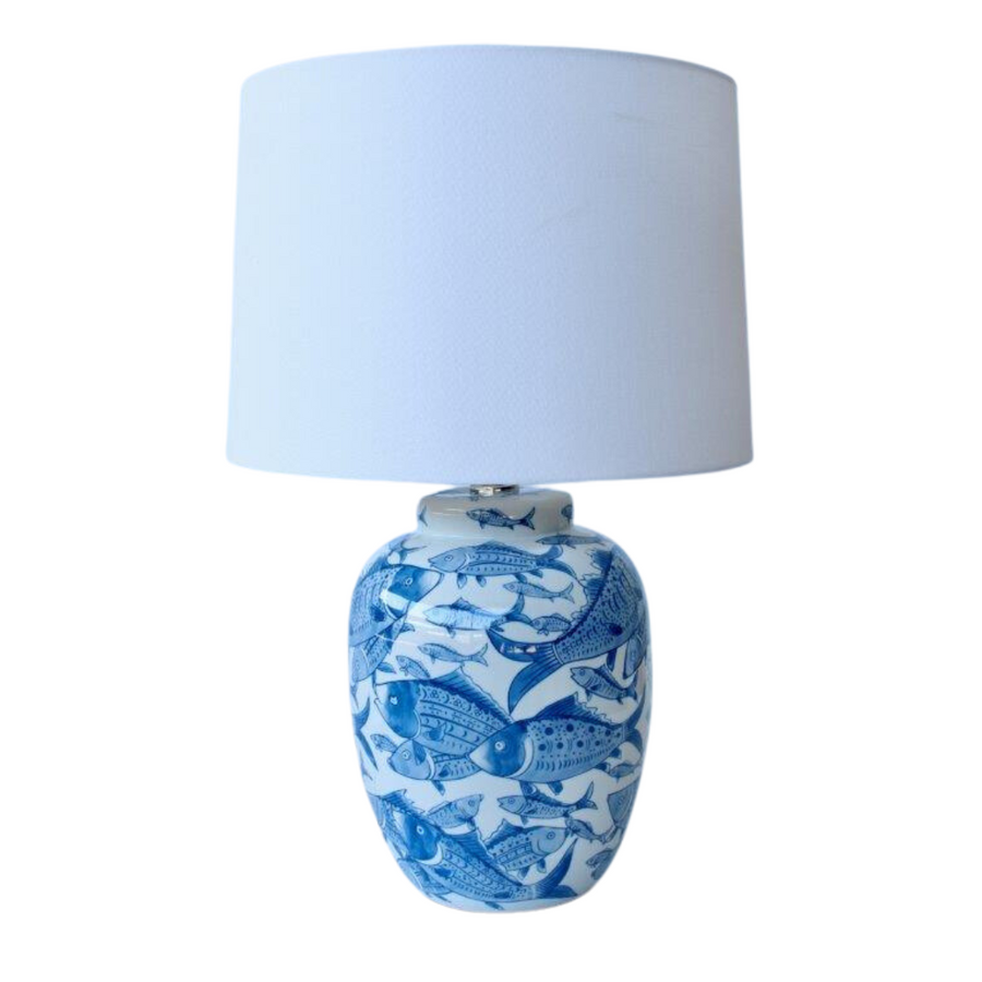 Blue & white fish lamp base off white shade 605x46cm  Introducing our Blue & White Fish Lamp Base from Unique Interiors, a stunning piece that will add a touch of whimsy to any room in your home. This lamp base is expertly handcrafted to perfection, ensuring the highest quality of craftsmanship.