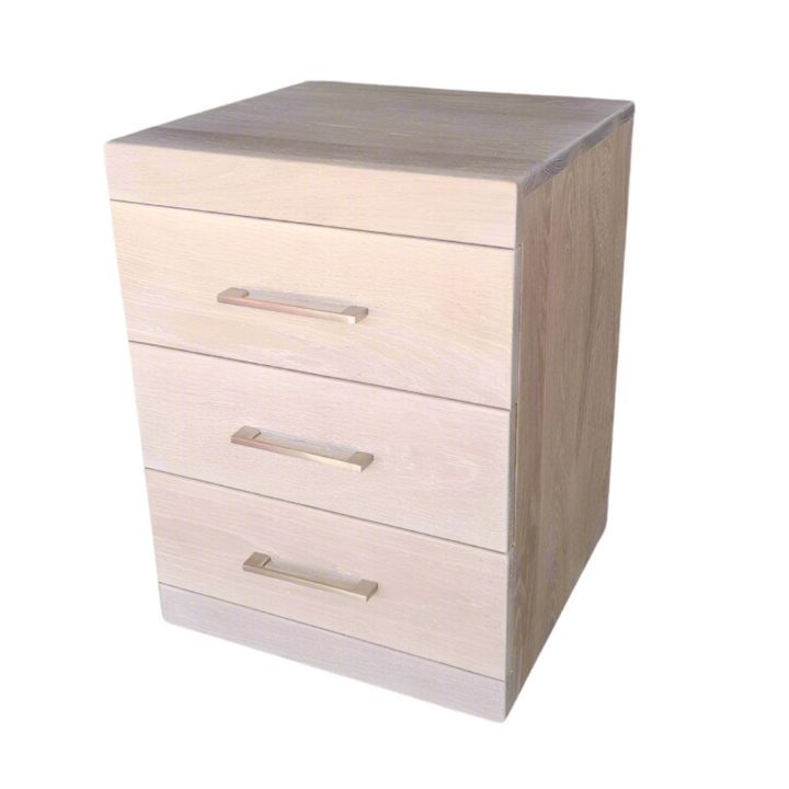 Becca Oak&nbsp; 3-Drawer Bedside Pedestal
Elevate Your Bedroom with Style and Functionality
Introducing our sleek Modern 3-Drawer Bedside Pedestal, expertly crafted with high-quality sealants and finishes. Perfect for any bedroom, its compact dimensions (500W x 500D x 600H) provide ample storage without compromising on style.