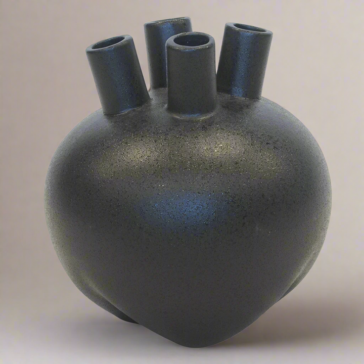 Ceramic Eyo Vase Black (20cm x 22cm)
Elevate your home decor with this stunning ceramic Eyo vase in sleek black. Expertly crafted, its modern design adds sophistication and style to any room.
Product Details:
Size: 20cm (H) x 22cm (D) (7.9 inches x 8.7 inches)
Material: High-quality ceramic
Color: Glossy black
Design: Unique Eyo-inspired shape with smooth finish
Features:
Sleek, modern design complements any decor style
Perfect size for showcasing small flower arrangements or greenery
