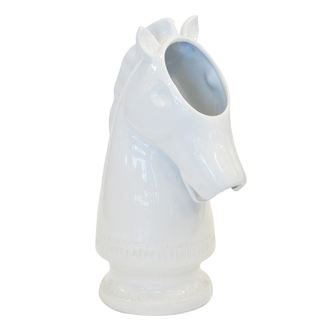 This white ceramic horse bust is sure to be the highlight of any room. At 46cm high and 30cm by 20cm in size, this bust is the perfect size to make a statement while not taking up too much space. Crafted from ceramic, this bust is sure to withstand the test of time, making it a timeless addition to your home.  Ceramic horse bust white   Size  46CM (H) X 30CM X 20CM  Unique Boys