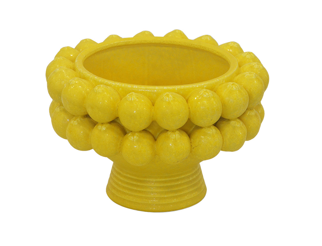 Elevate your serving experience with our Ceramic Lemon Pedestal Bowl. Standing at 24cm tall and 36cm in diameter, this bright yellow bowl adds a pop of color to any table setting. The perfect size for holding fruits or displaying desserts, it's both functional and stylish-UNIQUE INTERIORS