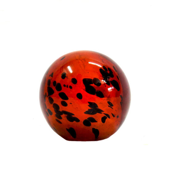 Introducing the Exquisite Ingwe Glass Ball
Elevate your home decor with the stunning Ingwe Glass Ball, expertly handcrafted to showcase rich amber tones and unique dark markings. This solid glass ball is a masterpiece of natural beauty, evoking a sense of wonder and awe