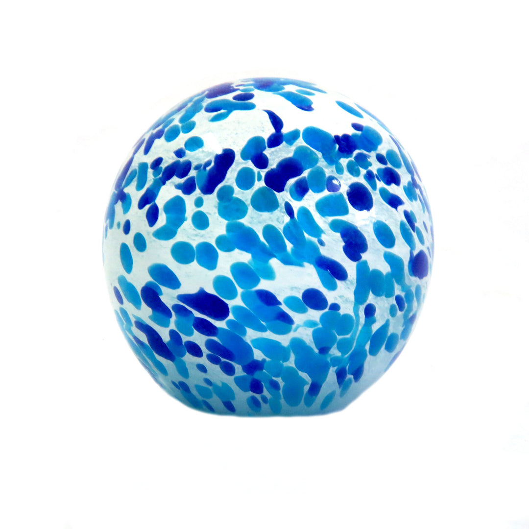 Introducing the Stunning Hydra Glass Ball
Bring the beauty of the Mediterranean sea into your home with the exquisite Hydra Glass Ball, expertly handmade to capture the essence of the ocean. This solid glass ball is a masterpiece of craftsmanship, featuring a unique composition that showcases shades of blue and aqua.