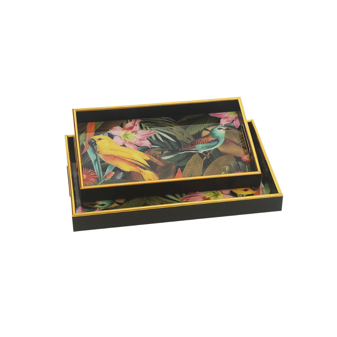 Expertly crafted for both functionality and style, the GLASS TRAY RECTANGLE CANARY S/2 is a must-have for any home. These trays come in two different sizes (46cm x 30cm x 5cm and 40cm x 26cm x 5cm), providing ample space for serving or displaying items. Made of high-quality glass, they are durable and elegant, adding a touch of sophistication to any room.Unique Interiors.