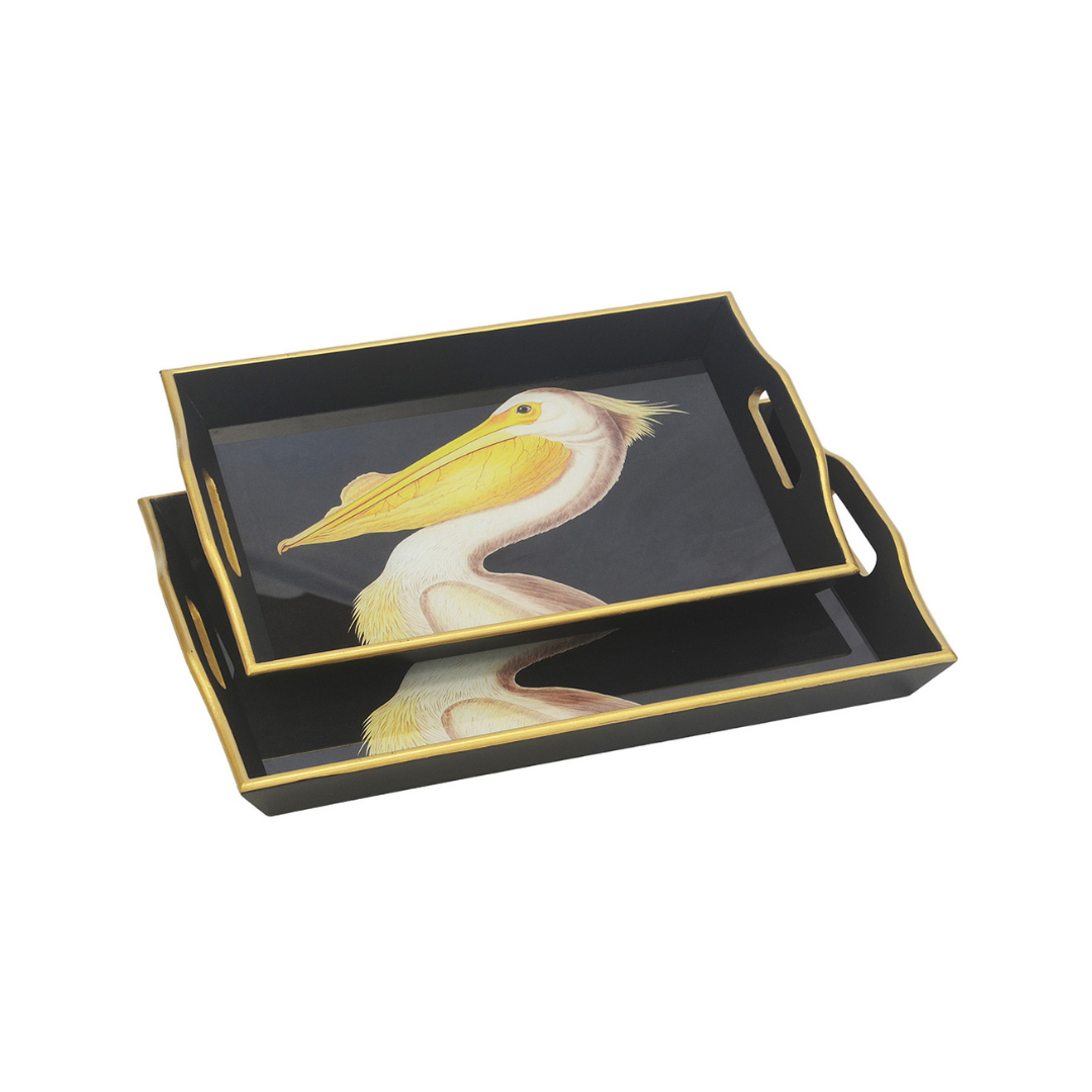 Add a coastal touch to your home decor with our GLASS WOOD TRAY RECTANGLE PELICAN S/2. Crafted with glass and wood, these trays come in two sizes: 50CM X 33CM X 5CM and 45CM X 29CM X 5CM. Perfect for serving or displaying your favorite items, these trays are a stylish and functional addition to any room.Unique Interiors.