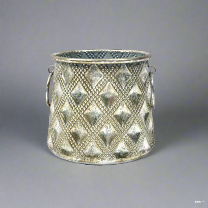 Manalini Vase
Product Description
Elevate your space with the elegant Manalini Vase. This versatile, metal container boasts an attractive surface pattern and antique silver finish. Use it as a candle lantern, vase, or planter for a touch of sophistication.