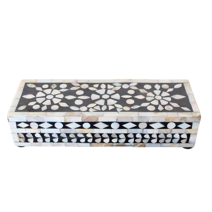 MOTHER OF PEARL BLACK OBLONG BOX 5X23X8CM This black oblong box measuring 5x23x8cm features beautiful mother of pearl accents. Crafted from high-quality materials, this box is perfect for storing small items or as a decorative piece. The elegant design and durable construction make it a functional and stylish addition to any space.     Delivery 5 to 7 working days