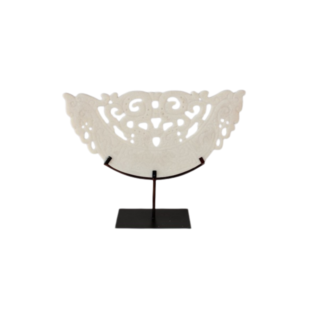 This large white cut out sandstone on metal stand will add a touch of elegance to any space. Made with high-quality sandstone and sturdy metal, this stand is durable and versatile. Perfect for displaying plants, statues, or other decor, this piece will elevate the look of any room.UNIQUE INTERIORS.