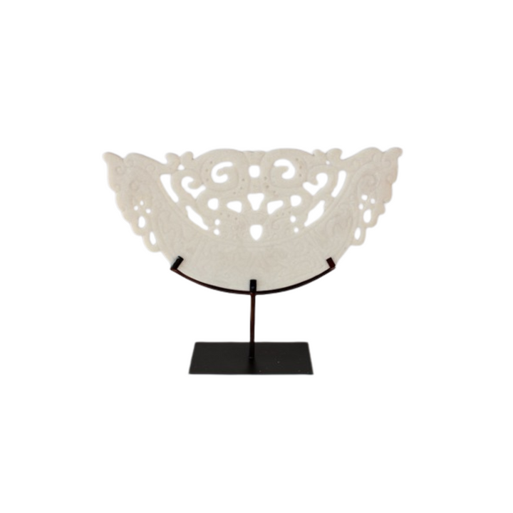 This large white cut out sandstone on metal stand will add a touch of elegance to any space. Made with high-quality sandstone and sturdy metal, this stand is durable and versatile. Perfect for displaying plants, statues, or other decor, this piece will elevate the look of any room.UNIQUE INTERIORS.