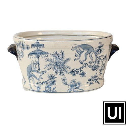 This large blue monkey foot bath adds a whimsical element to any outdoor space. Its unique 20x41x28cm size gives plenty of room for your favorite flowers and plants. Constructed with durable resin, it's a great and stylish option to decorate your patio, garden, or deck.  Unique Interiors, a place where you can find trendy decor that stays forever in style for any style.