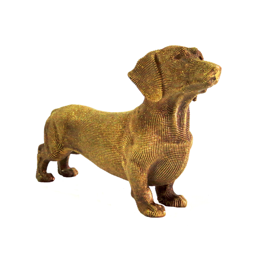 Leopoldina Sausage Dog: A Touch of Whimsy
Add a dash of personality to your home decor with the charming Leopoldina Sausage Dog. This exquisite, gold-colored figurine is sure to delight sausage dog lovers and design enthusiasts alike.
Unique Design
Measuring 24.5cm in length and 14.5cm in height, this beautifully crafted piece is the perfect conversation starter. Weighing 310g, it's substantial enough to make a statement, yet lightweight enough to place anywhere.
Product Specifications
Size: 24.5cm x 14.5cm