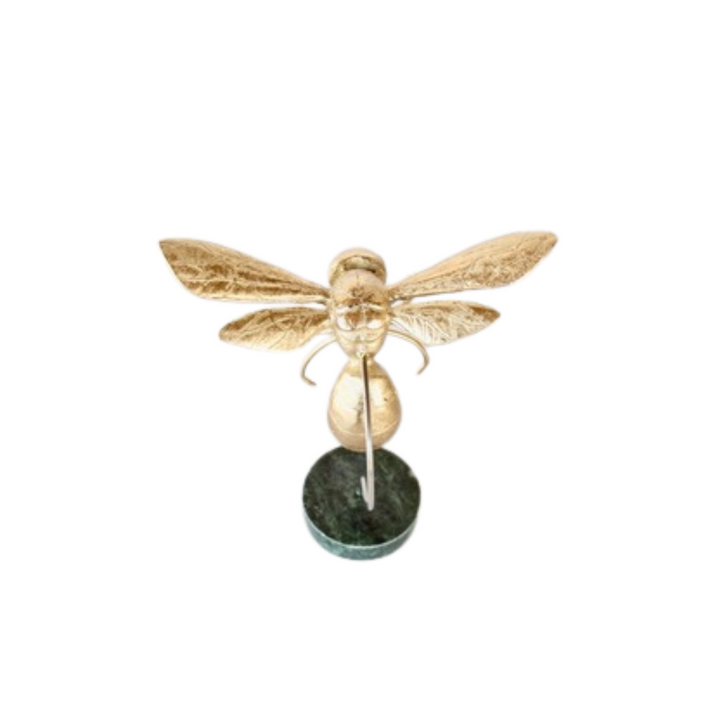 This medium-sized gold bumblebee is expertly crafted and displayed on a beautiful marble base, measuring 19x18x10cm. Enhance your home decor or office space with this unique and elegant piece. Made with precision and attention to detail, this bumblebee adds a touch of sophistication to any setting.UNIQUE INTERIORS.