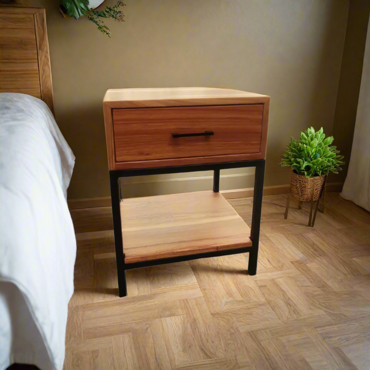 Kiaat BedsidKiaat Bedside Pedestal with 1 Drawer and Shelf
Elevate your bedroom with our stunning Kiaat bedside pedestal, featuring a single drawer and shelf on a metal frame.
Product Specificationse Pedestal with 1 Drawer and Shelf
Elevate your bedroom with our stunning Kiaat bedside pedestal, featuring a single drawer and shelf on a metal frame.
Product Specifications