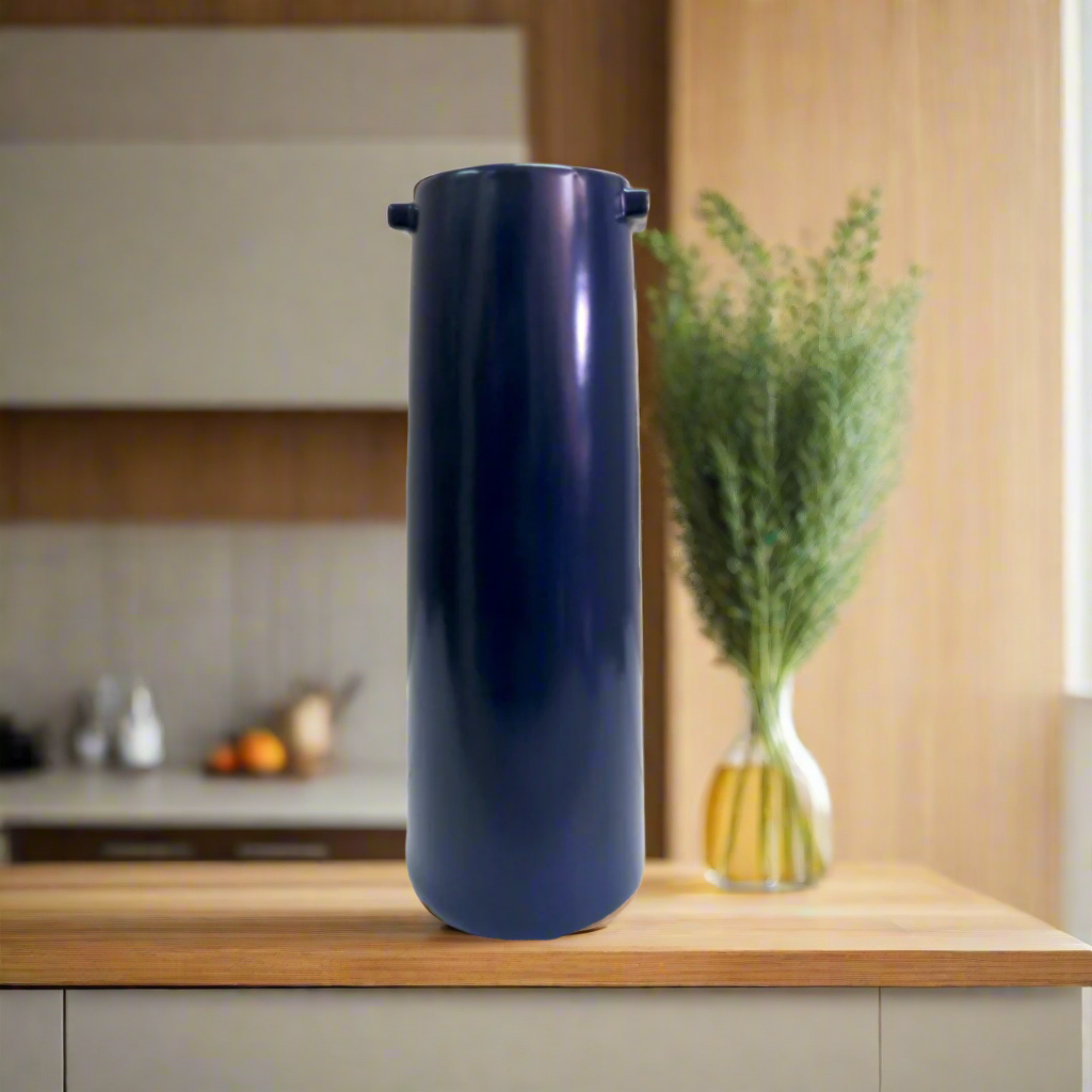 Nomad Vase
Add a Touch of Elegance to Any Room!
Bring life and beauty to your space with the stunning Nomad vase. Crafted from gorgeous blue ceramic, this timeless piece features: