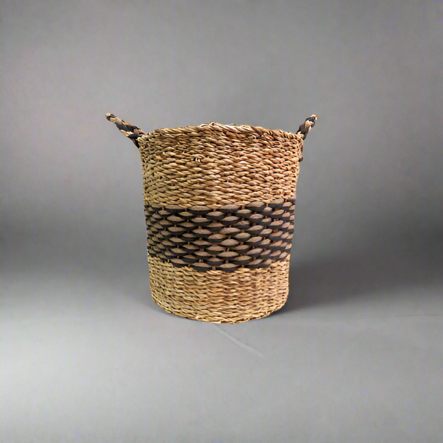 Product Details: Phelix Basket
Description: A stunning and chunky basket made from a combination of seagrass and jute, featuring a striking natural and black colorway.
Material: Seagrass and jute
Size: 40cm diameter x 40cm height
Features:
Handles for easy carrying
Chunky and beautifully woven design
Natural and black colorway
Uses:
Home decor: Add a touch of natural elegance to your living room, bedroom, or kitchen.
Storage: Perfect for storing books, magazines, or other small items.
Store: Unique Boys, of