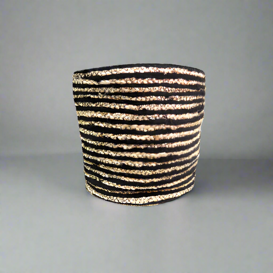 Product Details: Planet Basket
Description: A beautifully handcrafted Planet Basket made from jute, featuring narrow black and natural stripes, perfect for adding a touch of class and elegance to any home.
Material: Jute
Size:
Diameter: 30cm
Height: 28cm