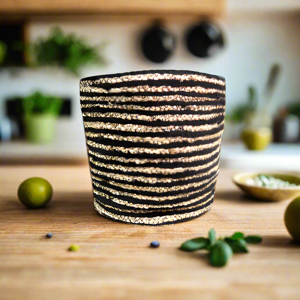 Product Details: Planet Basket
Description: A beautifully handcrafted Planet Basket made from jute, featuring narrow black and natural stripes, perfect for adding a touch of class and elegance to any home.
Material: Jute
Size:
Diameter: 30cm
Height: 28cm