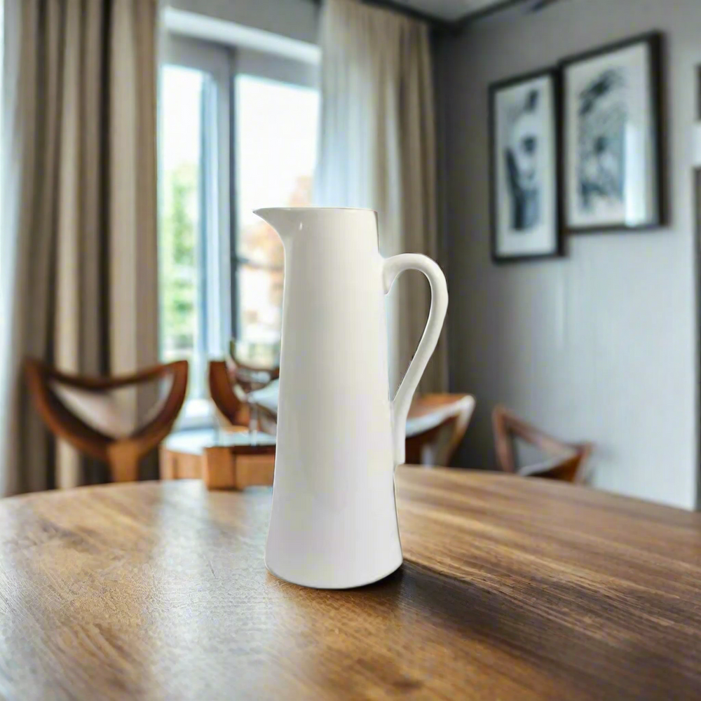 Port 2 Jug
The Port 2 Jug is a versatile and functional addition to your home decor. Measuring 16 X 12.5 X 30CM, this jug doubles as a planter, adding a touch of greenery to your space. Its sleek white design will effortlessly complement any style, making it a must-have for both practical and aesthetic purposes.