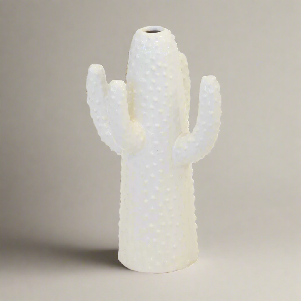 Ceramic cactus vase white medium  Size  30CM (H) X 18CM (W)  Ceramic porcelain decor   Unique Interiors  Bring a unique, southwestern charm to your home with this small ceramic cactus vase. Crafted with porcelain and boasting a white finish, this 30CM (H) X 18CM (W) vase is perfect for adding a distinct decoration to any living space. Ideal for the cactus and succulent lover, this vase will bring an unique and eye-catching element to your interiors.