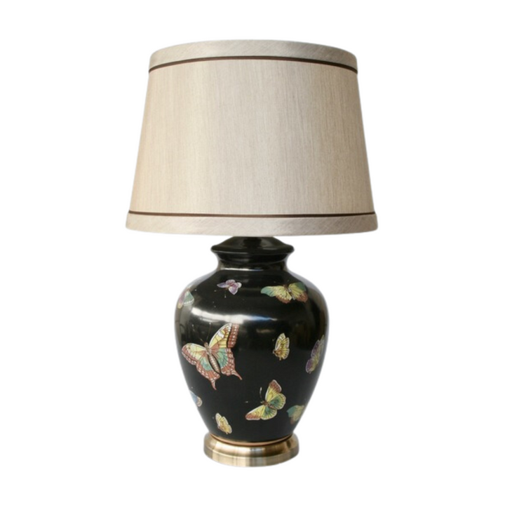 This 72cm H x 44.5cm Butterfly black base with shade makes an ideal statement piece for any lounge, bedroom, dining room, or reception area. This beautiful, handcrafted lamp adds a touch of finesse to any space.  Butterfly black base with shade   Size  72cm H x 44.5cm  Delivery 5 - 7 working days