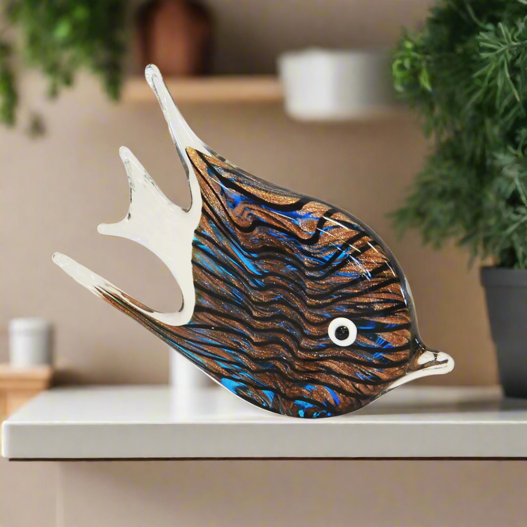 This magnificent Paperweight Fish Zebra Agate (22cm x 14cm) is perfect for adding a touch of unique sophistication to your living space. Crafted from premium quality speckled glass, the paperweight features an interior decor that is sure to make a bold statement. Delight your guests with this truly one-of-a-kind decoration.  Paperweight fish zebra agate (22cm x 14cm)  A beautiful speckled glass paperweight. interior decor  Unique Boys