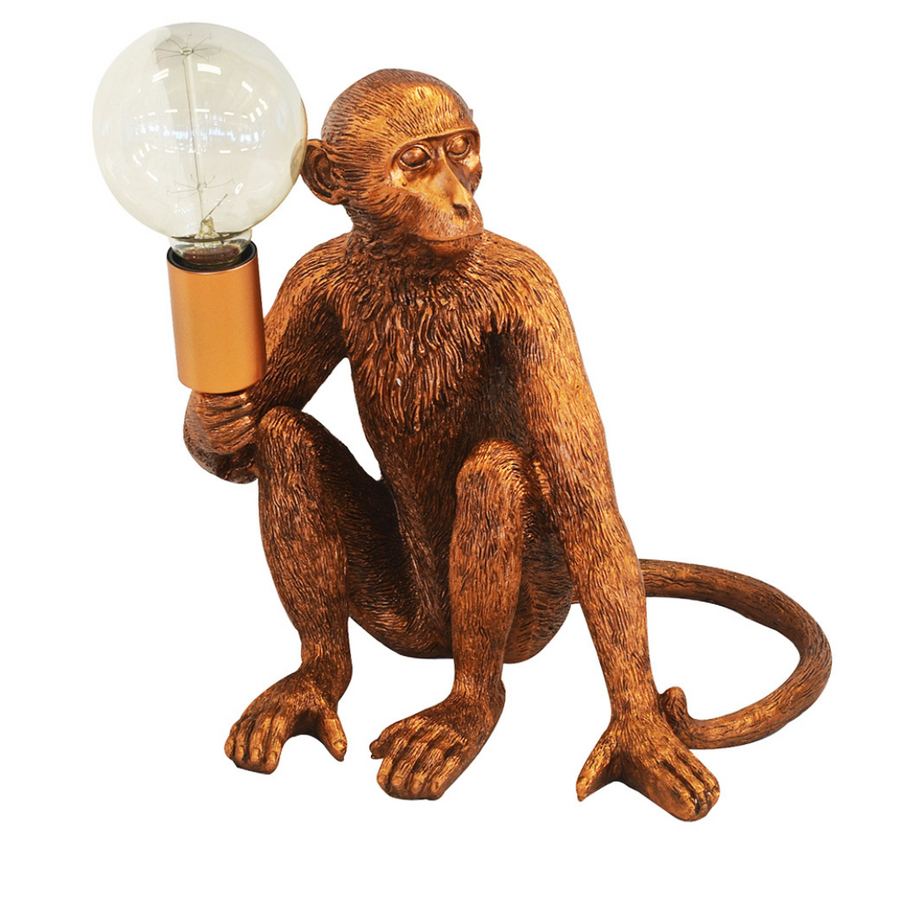 Bring a unique charm to your home with this 30cm copper monkey torch table lamp. Crafted from premium resin, this eye-catching piece is sure to become a conversation starter and a centerpiece of your interior decor. With a timeless design, the piece offers a stunning addition to any room.  Resin monkey torch copper  Size  30CM (H)  Monkeys are back in town!!! Rich copper monkey table lamp for the perfect addition to your home.  Interior Decor Piece.  www.uniqueboys.co.za