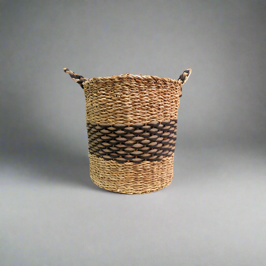 Product Details: Pharo Basket
Description: A stunning and chunky basket made from a combination of seagrass and jute, featuring a striking natural and black colorway.
Material: Seagrass and jute
Size: 35cm diameter x 35cm height
Features:
Handles for easy carrying
Chunky and beautifully made design
Natural and black colorway
Uses:
Home decor: Add a touch of natural elegance to your living room, bedroom, or kitchen.
Storage: Perfect for storing books, magazines, or other small items.
Store: Unique Boys, offe