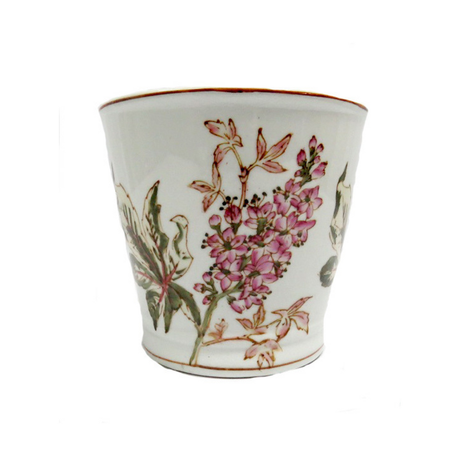 This Wildflower Planter features a beautiful handpainted design in pinks and greens on a porcelain pot that measures 17.5CMD in diameter and 15.5CMH in height. Add a touch of elegance to your garden or interior space with this unique and charming planter.Unique Boys