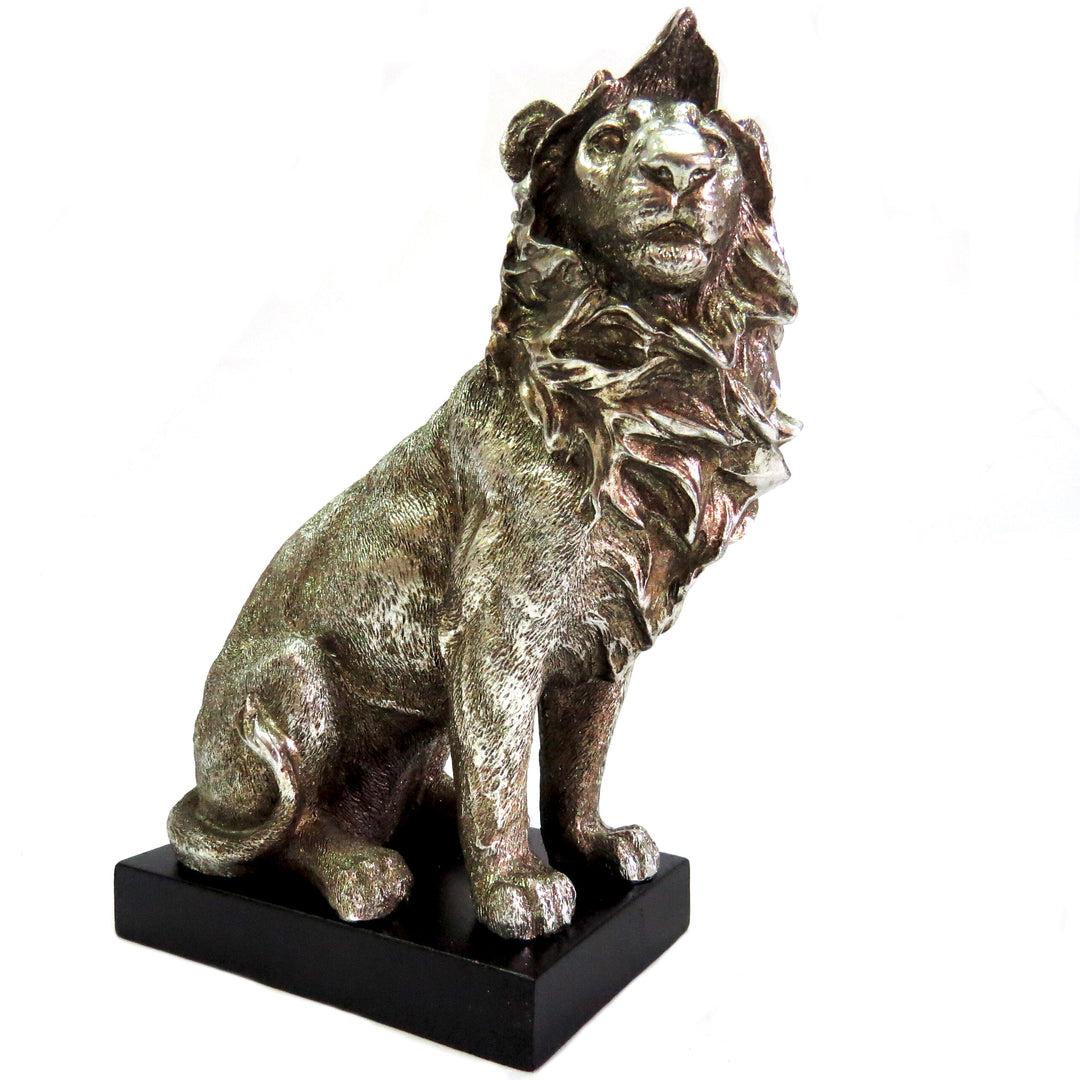 Introducing the Zimbo Lion - a stunning addition to any collection. This handsome antique silver lion stands at 12.5cm width and 15cm height on a black plinth, showcasing its beautifully formed and colored 630gms. A must-have for any lion enthusiast-Unique Boys