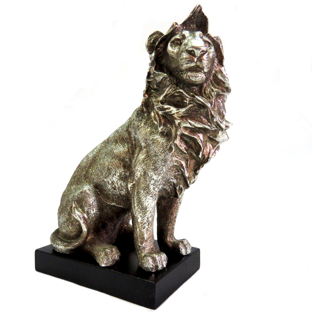 Introducing the Zimbo Lion - a stunning addition to any collection. This handsome antique silver lion stands at 12.5cm width and 15cm height on a black plinth, showcasing its beautifully formed and colored 630gms. A must-have for any lion enthusiast-Unique Boys