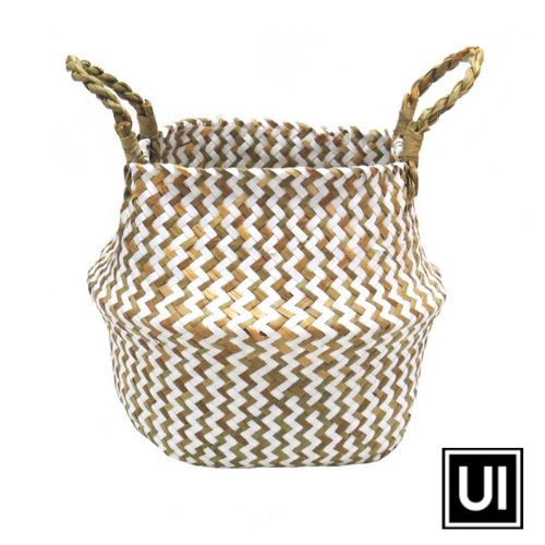 This Persell basket features chevron weaving in white and natural colors, resulting in a unique and beautifully finished basket. The basket's natural twisted handles ensure a secure and sturdy grip while making it an attractive addition to any outdoor space.Unique Interiors.